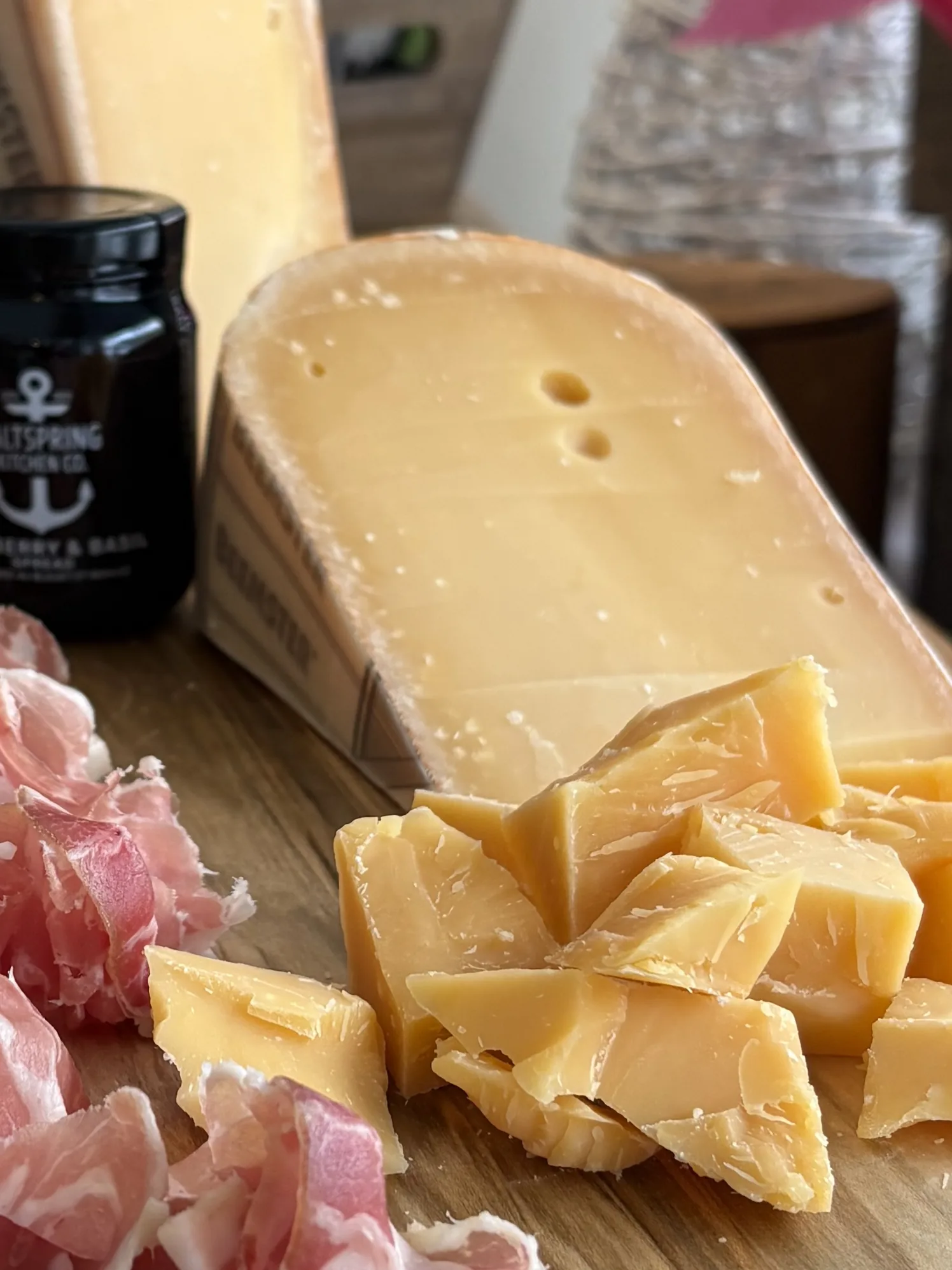 Wedge of aged cheese with charcuterie