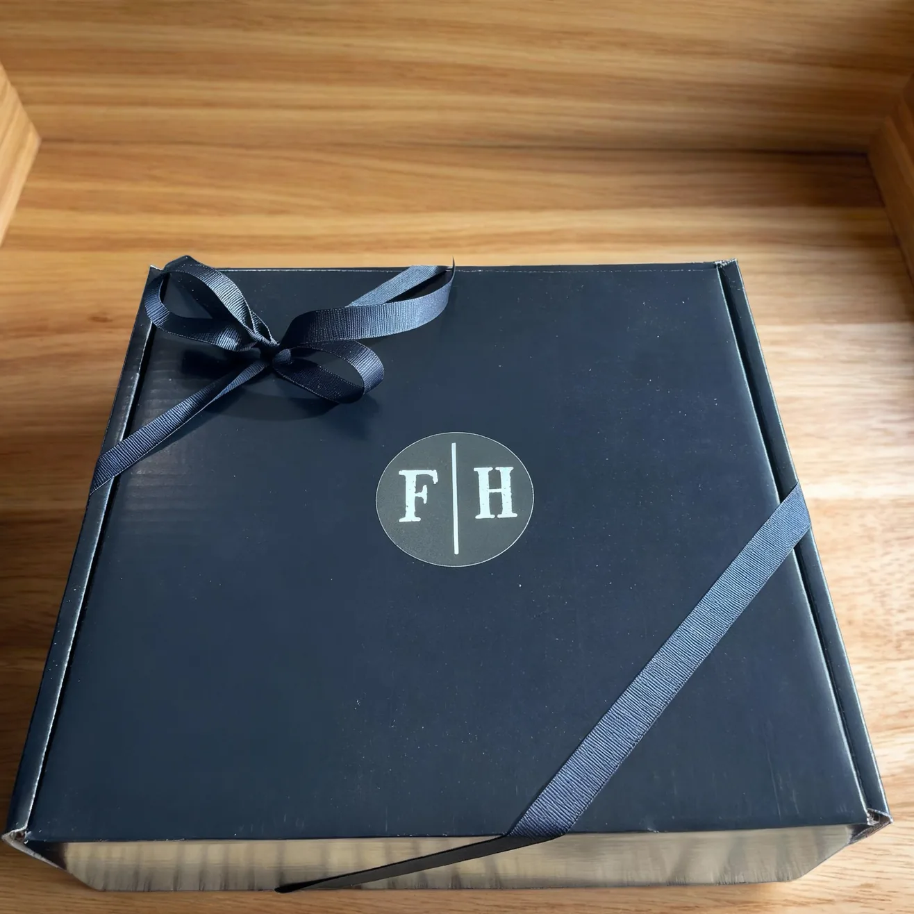 Farmhouse Artisan Cheese gift box tied with ribbon