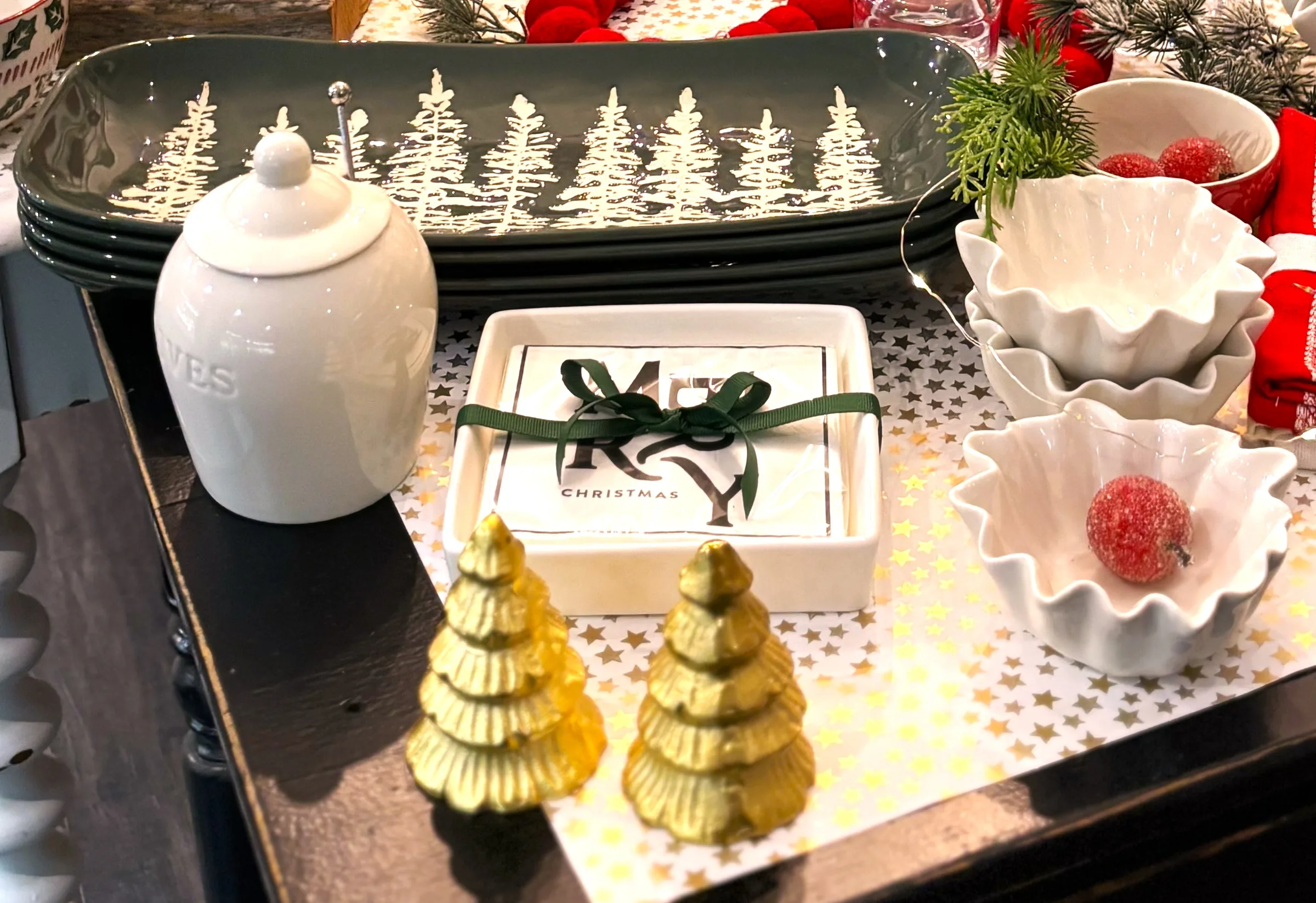 Holiday gift display with serving dishes and ornaments