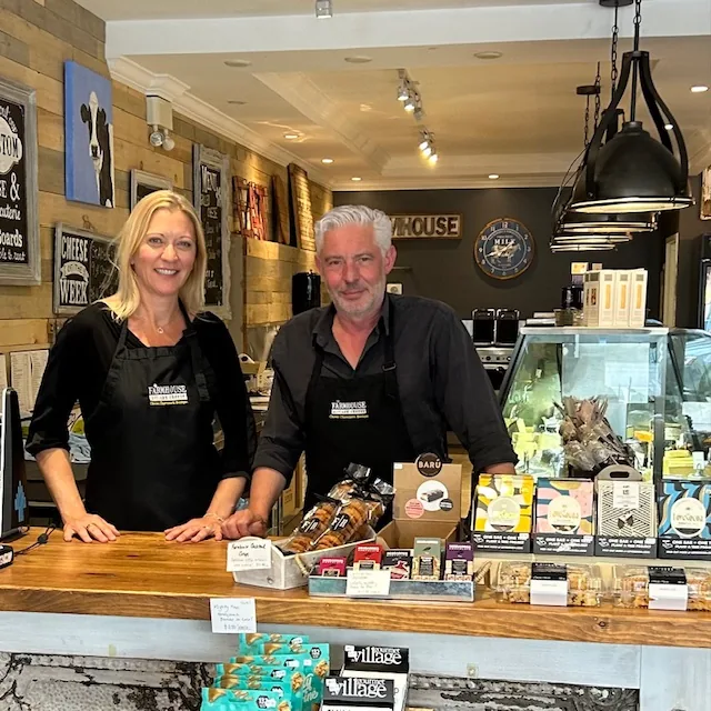Owners Stéphane and Laure behind the counter at Farmhouse Artisan Cheese